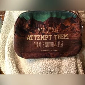 Gently used Beautiful Clutch Purse with a great Tennessee Williams quote